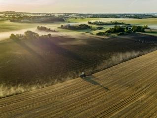 Tractor ploughing a rural field