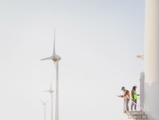 Two wind turbine engineers working at height