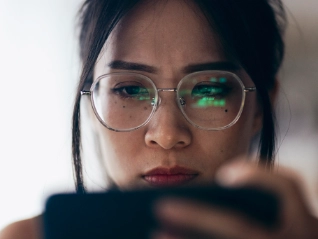 Taiwanese lady inspecting her phone