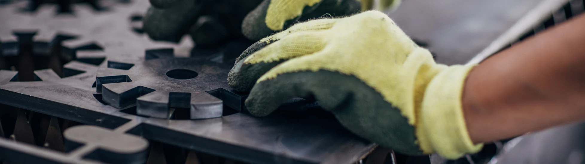 Close up of an engineer forming a metal component
